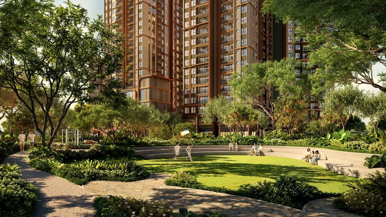 Thảm cỏ, khán đài ngoài trời và lối dạo bộ dưới tán cây trong công viên nội khu Norton Park